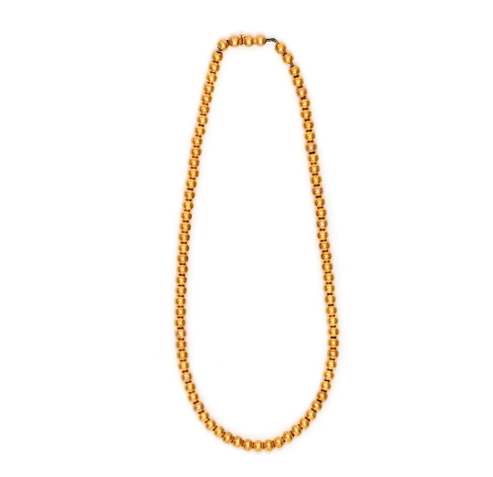 Appraisal: k Yellow Gold Beaded Necklace One strand of k yellow