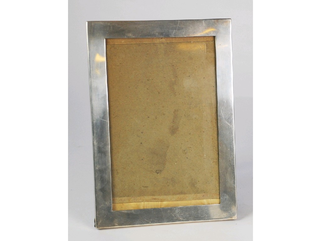 Appraisal: GEORGE V SILVER EASEL PHOTOGRAPH FRAME plain oblong form x