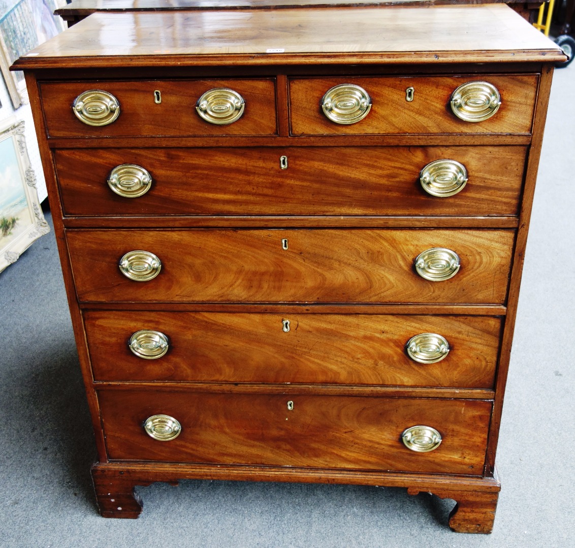 Appraisal: A George III crossbanded mahogany and pine chest of two