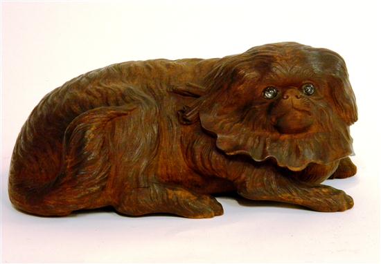 Appraisal: th C wooden sculpture reclining Pekingese with glass eyes few