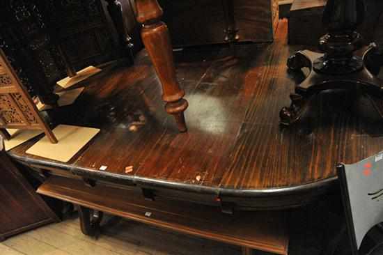 Appraisal: A VICTORIAN CIRCULAR EXTENDING TABLE WITH THREE SPARE LEAVES