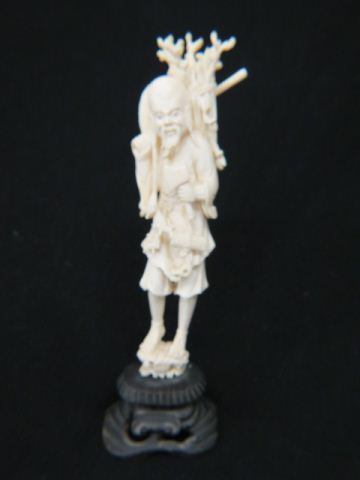 Appraisal: Chinese Carved Ivory Figurine of Manwith large hat firewood on