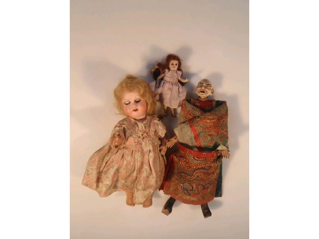 Appraisal: A small early thC bisque headed doll by Armand Marseille