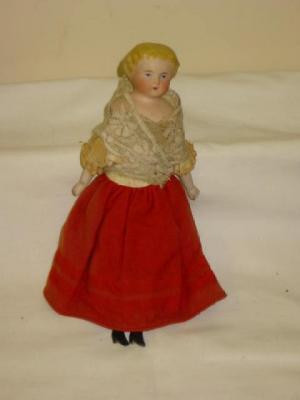 Appraisal: A china shoulder head doll with painted face moulded hair