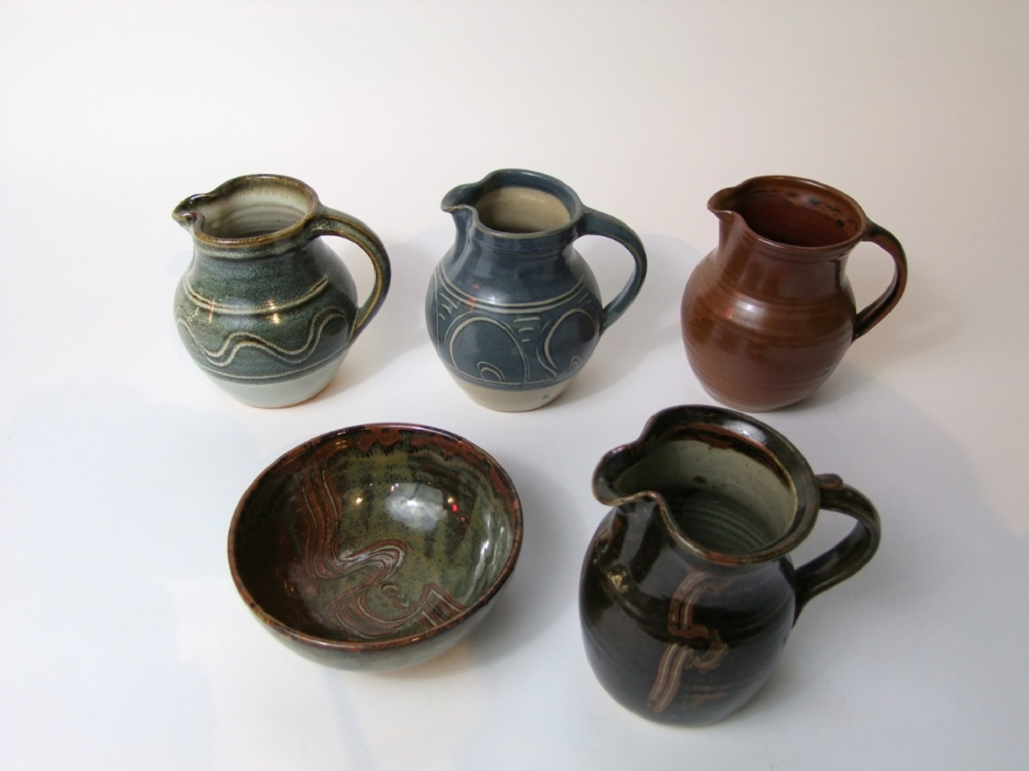 Appraisal: A collection of Winchcombe Studio Pottery wares comprising a jug