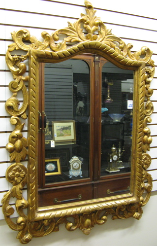 Appraisal: A GILT WOOD CARVED RECTANGULAR WALL MIRROR in the Italian