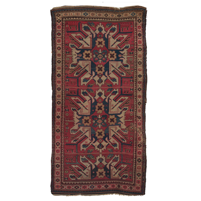 Appraisal: Eagle Kazak rug c stylized floral design on a red