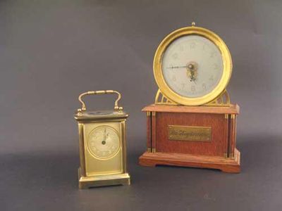 Appraisal: A French oak cased 'Mystery Clock' with brass bezel 'La