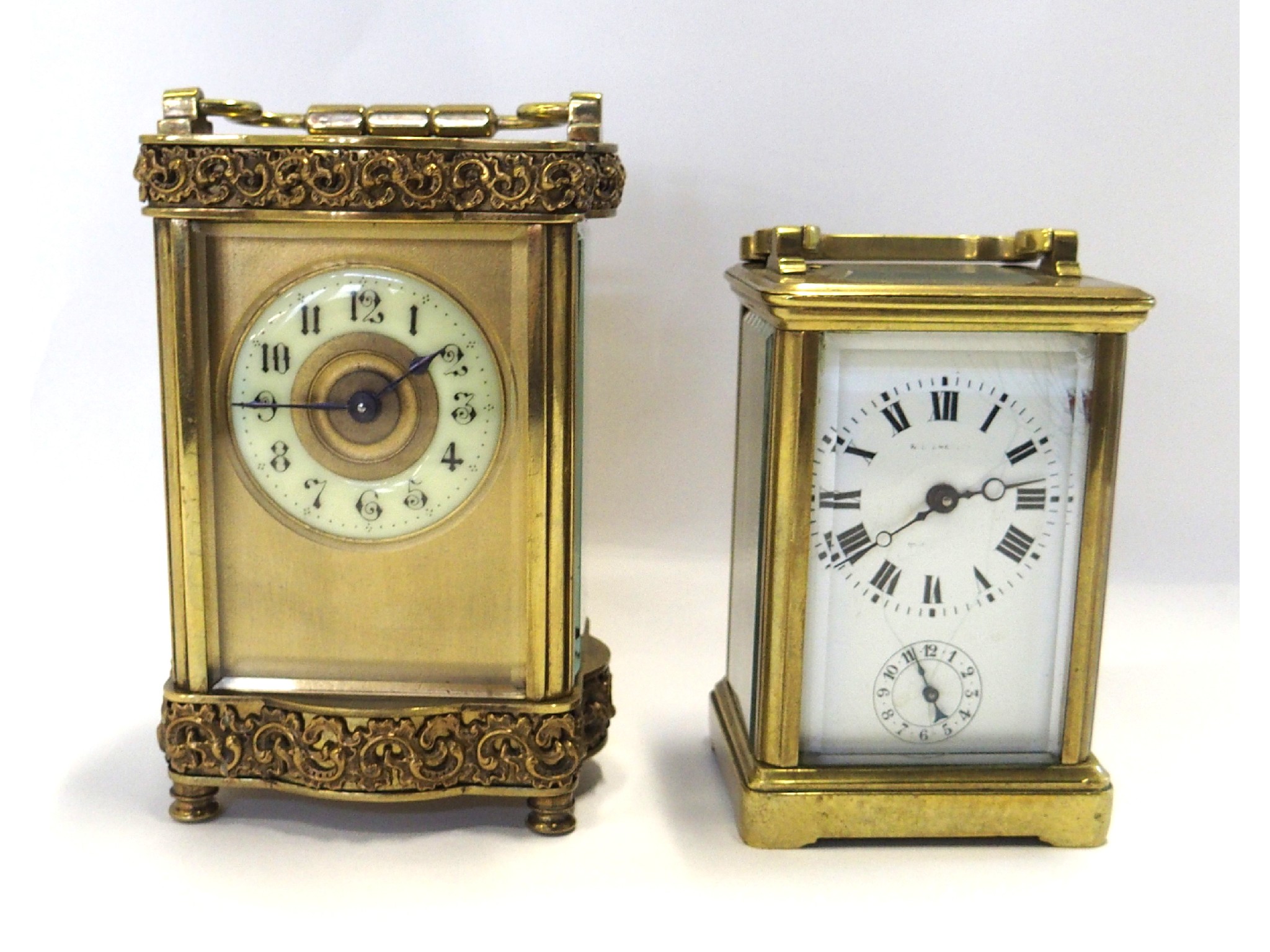 Appraisal: Brass carriage clock with cast decorative panels and a small