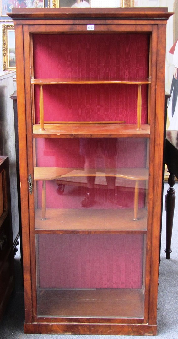 Appraisal: A Biedermeier mahogany floor standing single door display cabinet cm