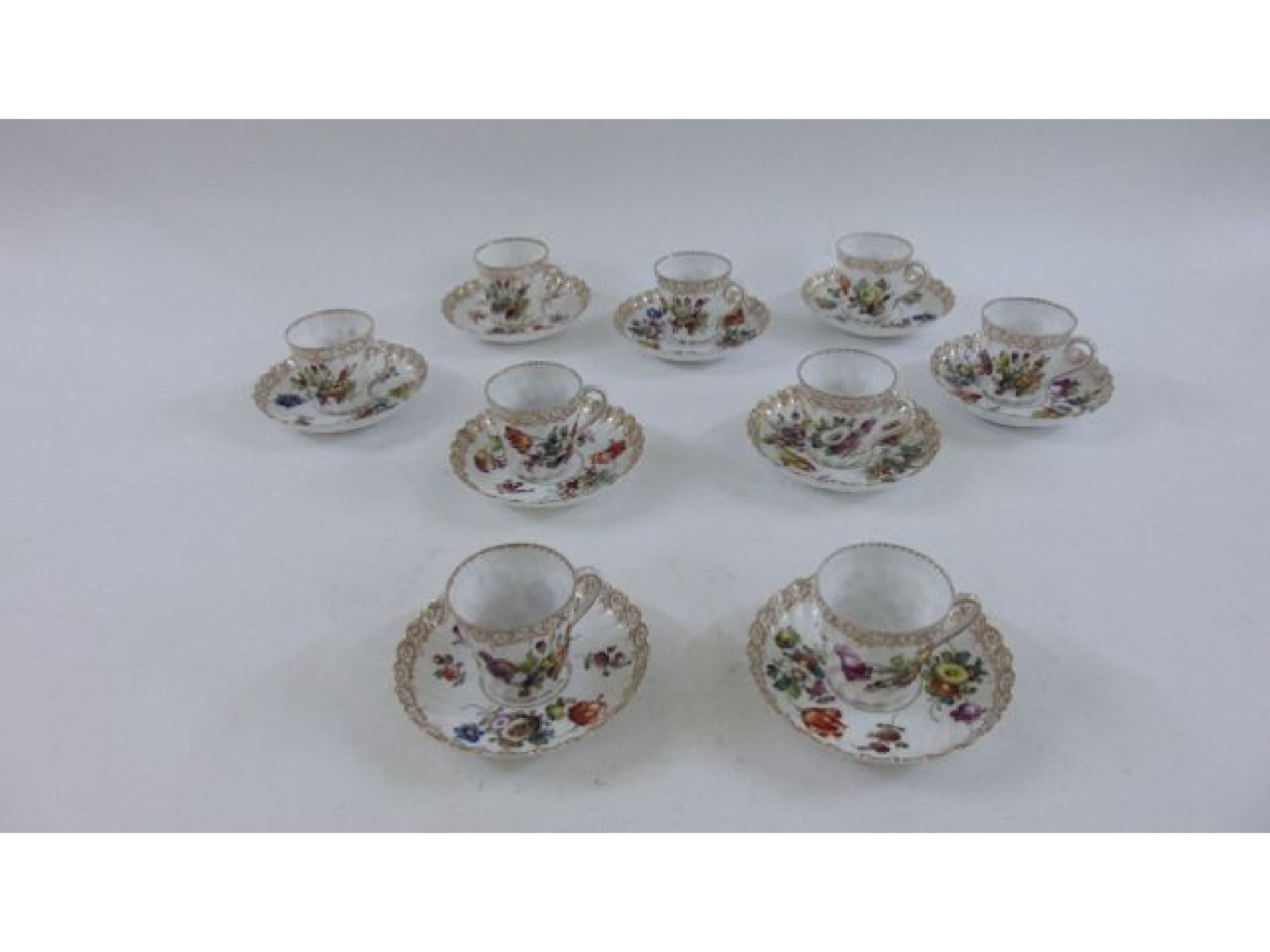 Appraisal: A set of nine German porcelain probably Dresden tea cups