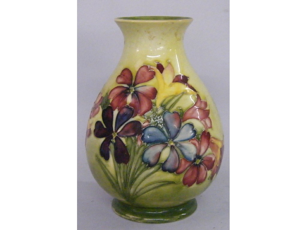 Appraisal: Moorcroft 'Orchids and Spring Flower' ovoid vase decorated on a