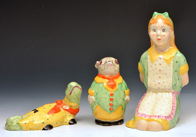 Appraisal: THREE POTTERY FIGURES taken from Alice in Wonderland by Isobel