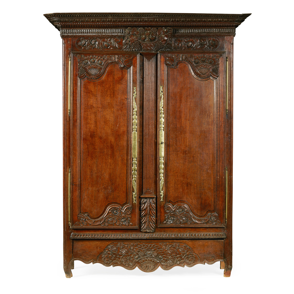 Appraisal: FRENCH PROVINCIAL WALNUT ARMOIRE TH CENTURY the projecting cornice with