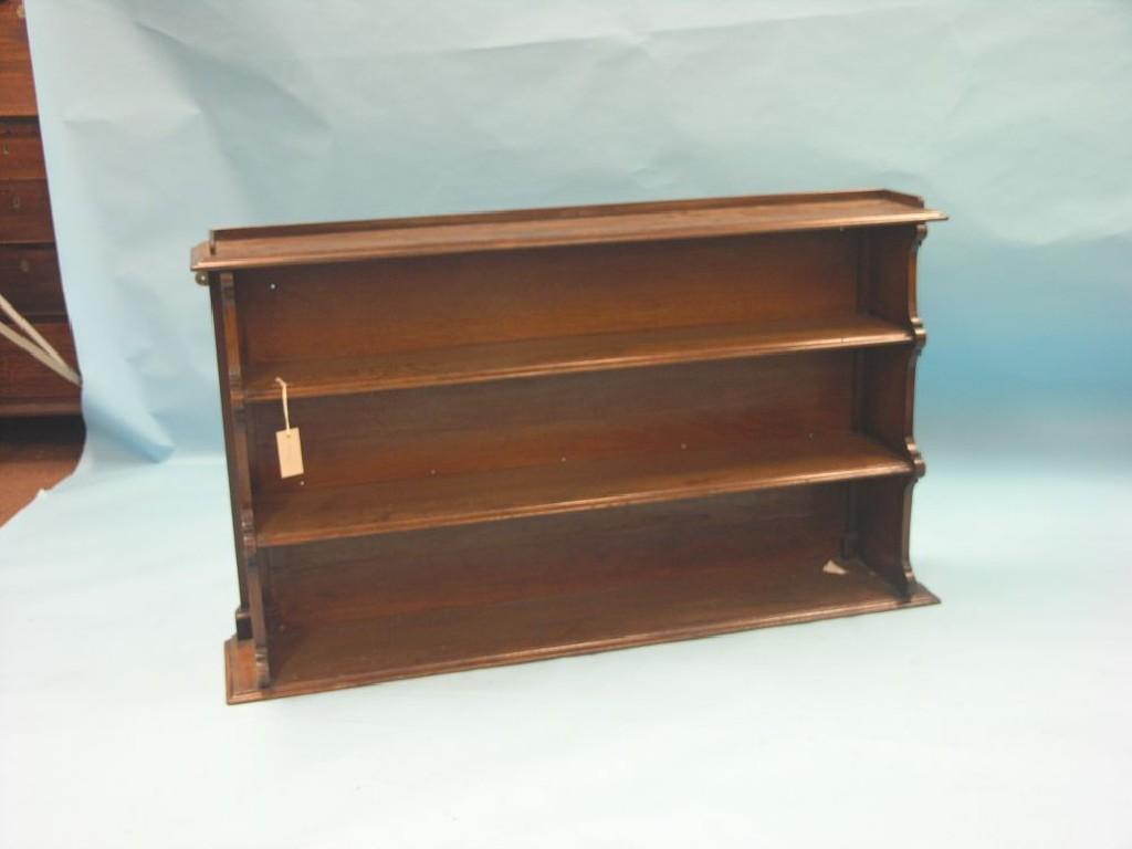 Appraisal: A Victorian mahogany open bookcase tray-top above three shelves ft