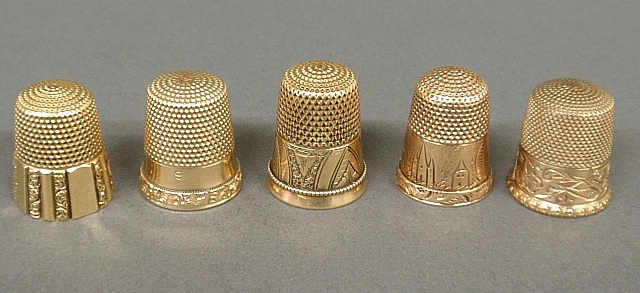 Appraisal: - Five gold thimbles- marked k marked k dwt -