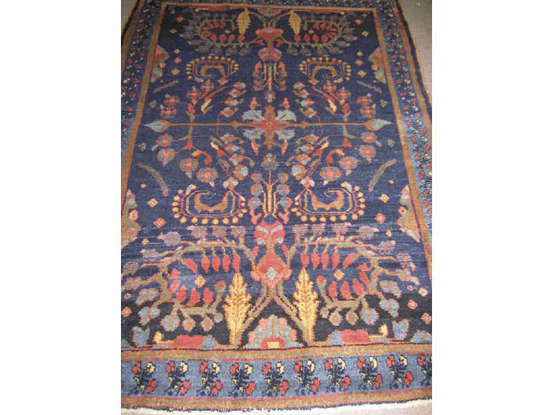 Appraisal: HAMADAN THROW RUG The indigo field with allover curvilinear floral