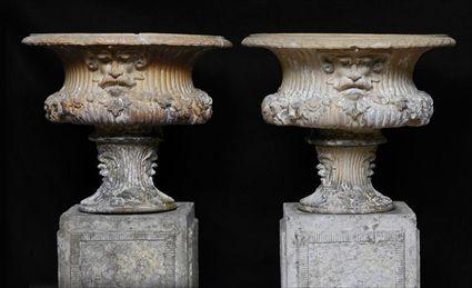 Appraisal: PAIR OF TERRACOTTA URNS The urns on conforming socles x