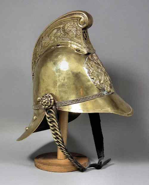 Appraisal: An Edwardian Merryweather pattern brass fireman's helmet with original leather