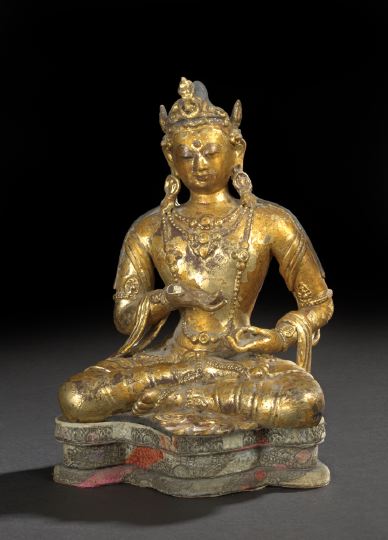 Appraisal: Tibetan Gilt-Wooden Statue of a Goddess the figure seated in