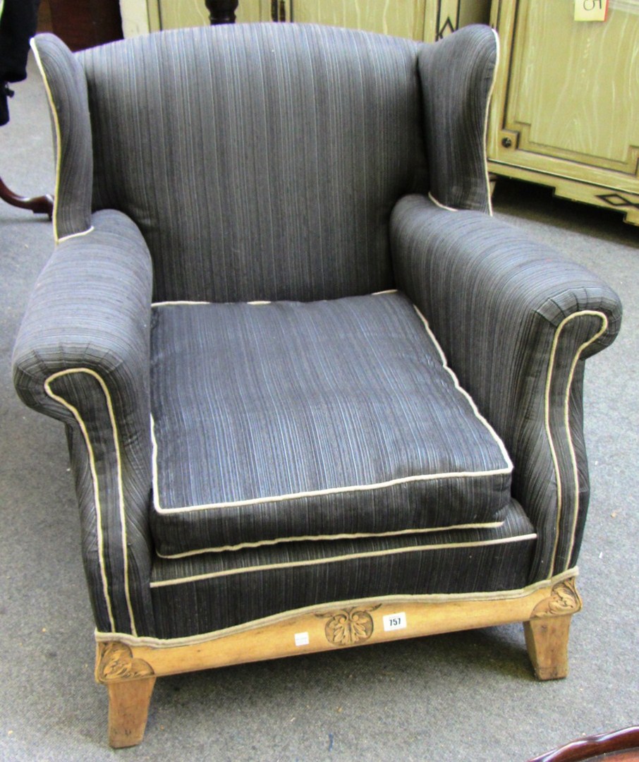 Appraisal: A pair of limed beech easy armchairs with acanthus carved