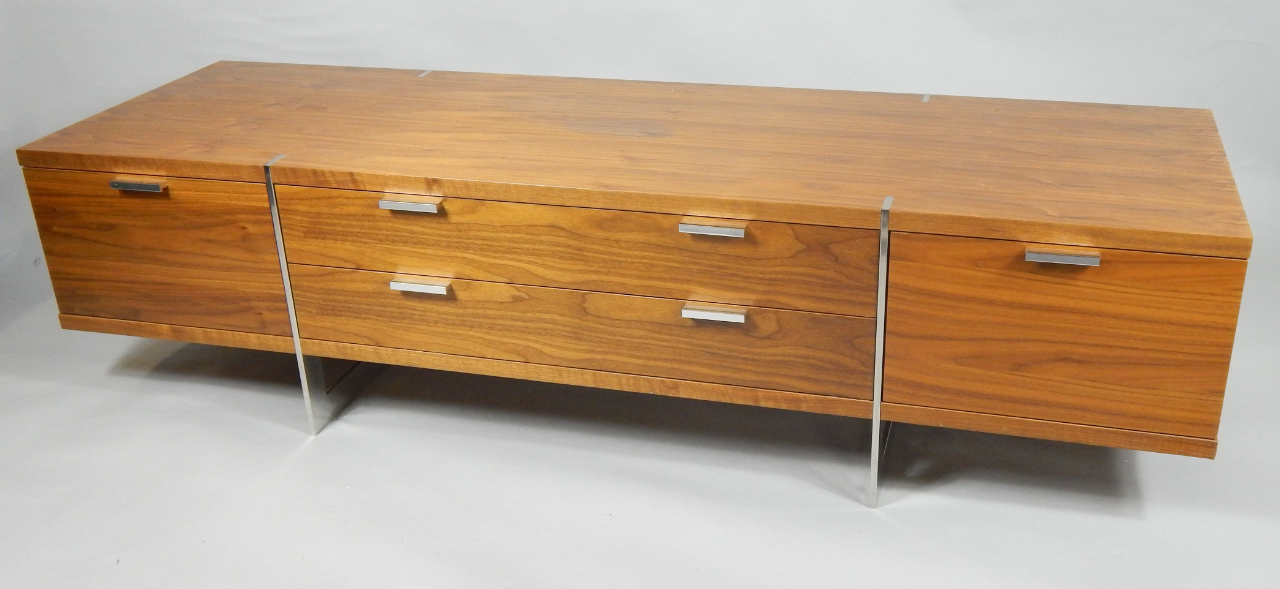 Appraisal: An IKEA teak and rosewood sideboard with two drawers flanked