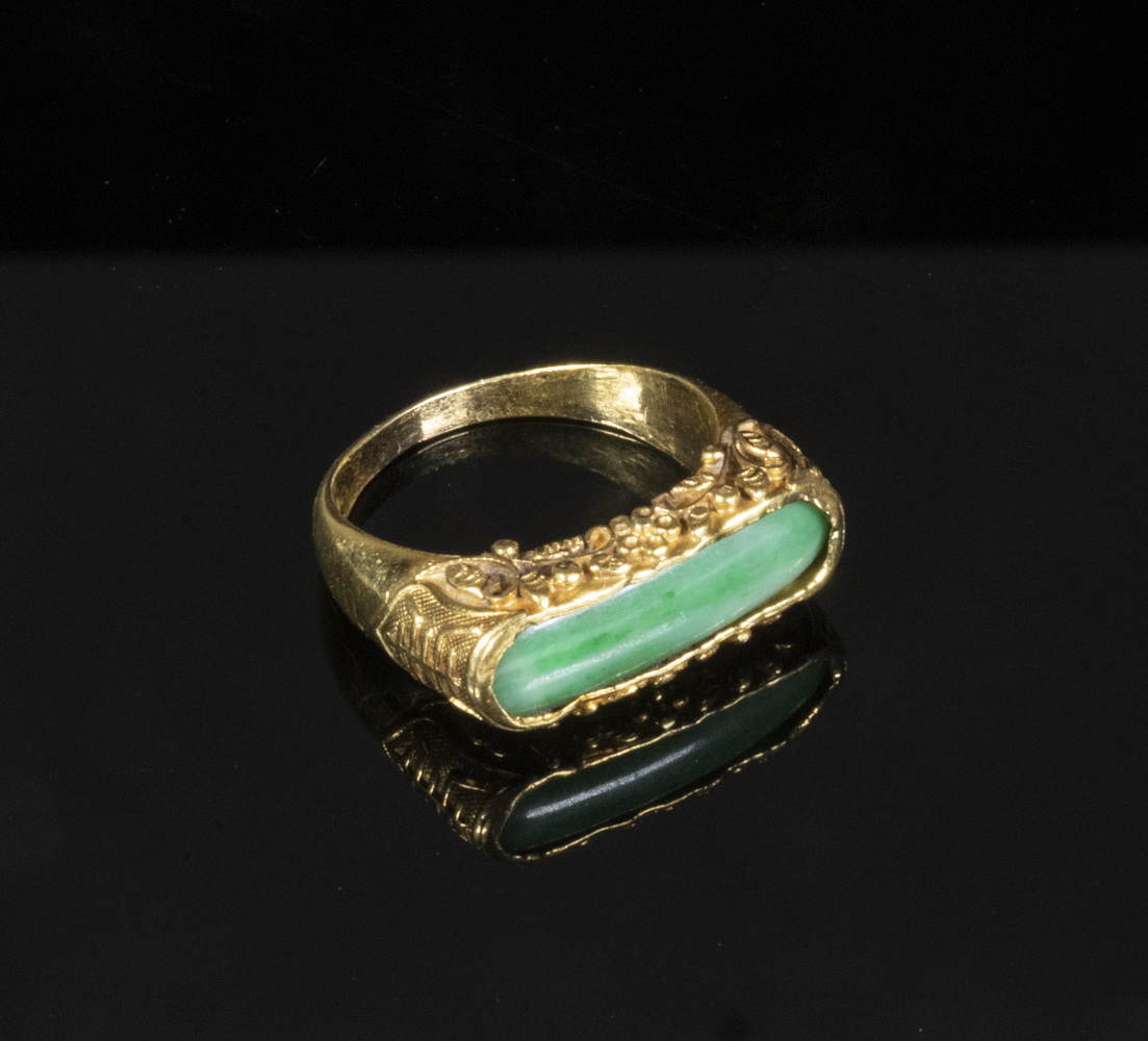 Appraisal: CHINESE GOLD JADE RING Carved K Yellow Gold Jade Saddle