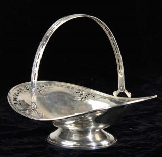 Appraisal: Dominick Haff sterling silver swing handle basket with floral motif