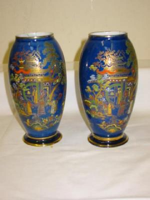 Appraisal: A PAIR OF CARLTON WARE OVOID VASES printed and painted