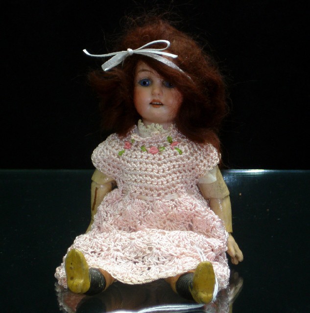 Appraisal: A cabinet size Armand Marseilles bisque head doll with brunette