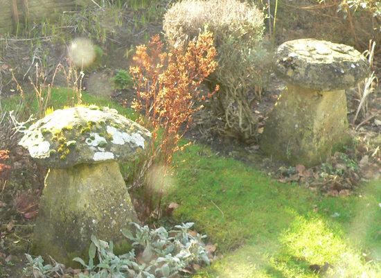 Appraisal: A staddle stone and a tapered base and another almost