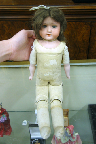 Appraisal: GERMAN BISQUE SHOULDER HEAD CHILD DOLL having blue sleep eyes