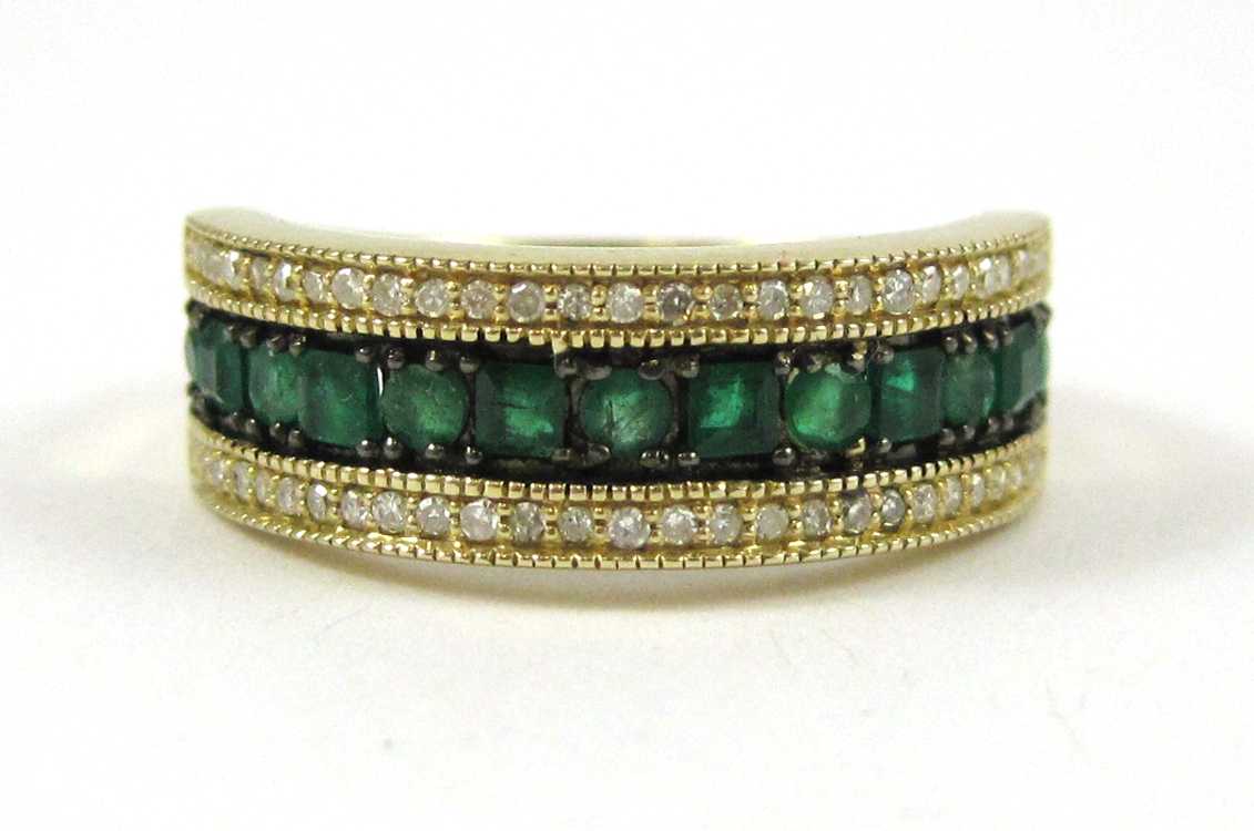 Appraisal: EMERALD DIAMOND AND FOURTEEN KARAT GOLD RING with a row