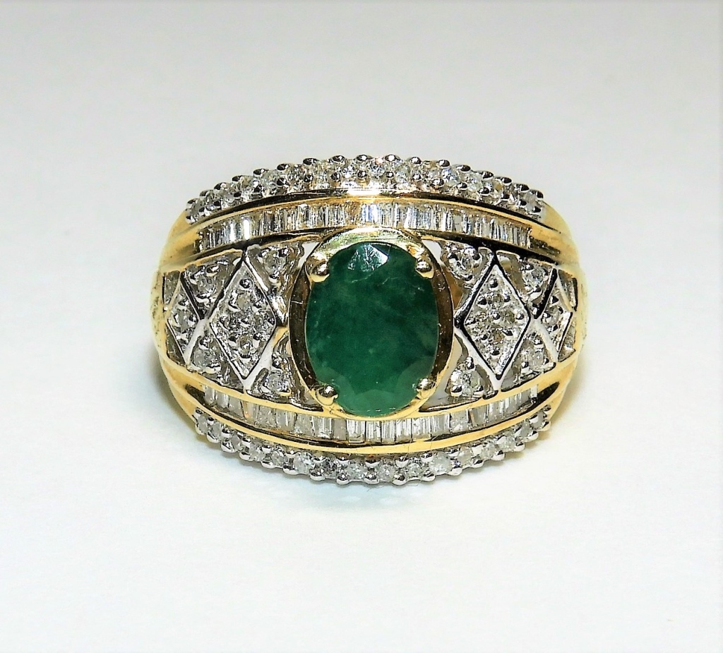 Appraisal: K YELLOW GOLD DIAMOND EMERALD COCKTAIL RING ContemporaryOval cut emerald