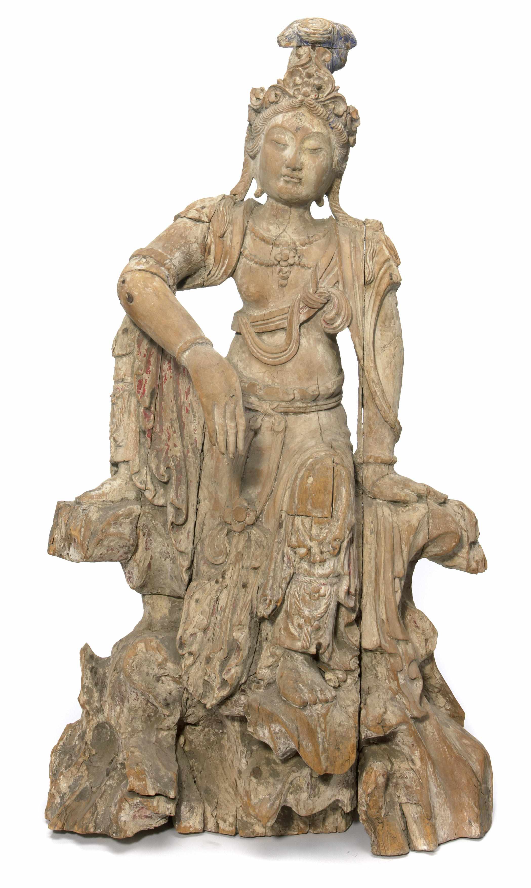 Appraisal: A carved gesso wood figure of a seated Guanyin height