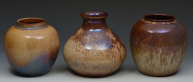 Appraisal: Ashworth PotteryThree lustre vases circa two with running brown glaze