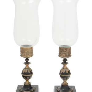 Appraisal: A Pair of Continental Metal Candlesticks th Century with hurricane