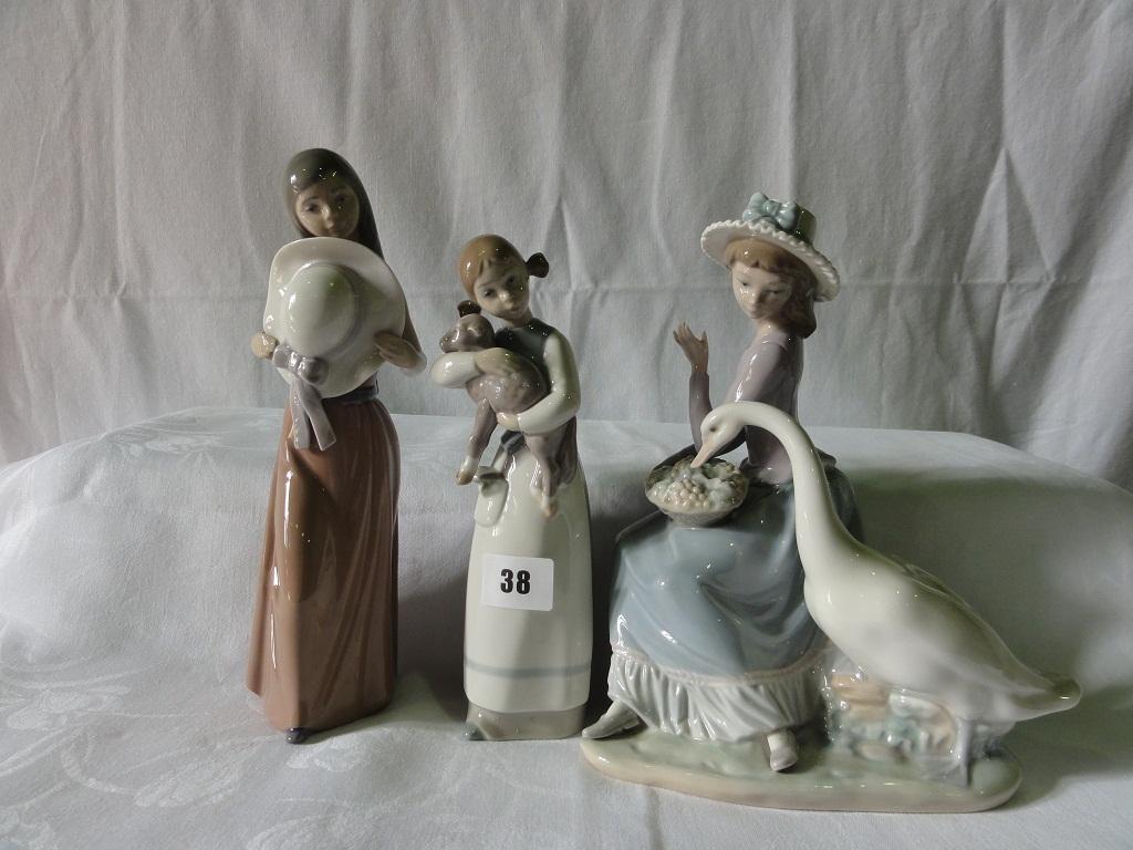 Appraisal: Two Lladro figures one of a girl feeding a pair