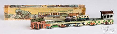 Appraisal: ARNOLD LITHOGRAPHED TIN WIND-UP REVERSING TRAINArnold lithographed tin wind-up reversing