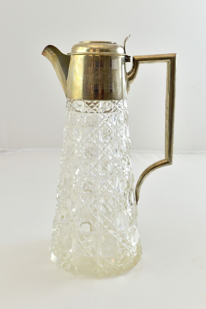 Appraisal: A silver mounted hobnail cut glass claret jug with an