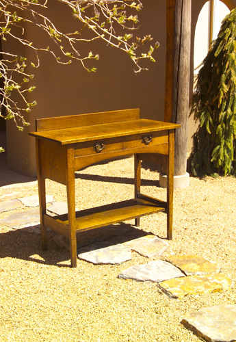 Appraisal: GUSTAV STICKLEY Two-drawer server with backsplash arched apron to front