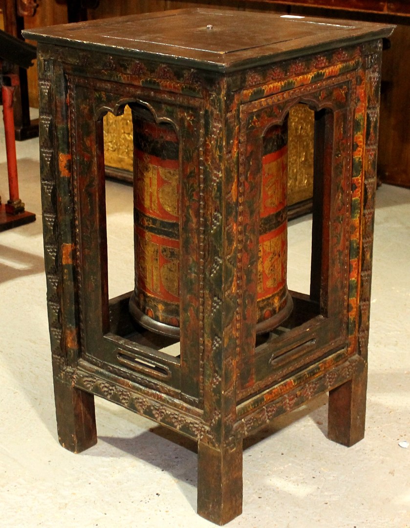 Appraisal: A Tibetan Buddhist prayer wheel with hardwood stand cm wide