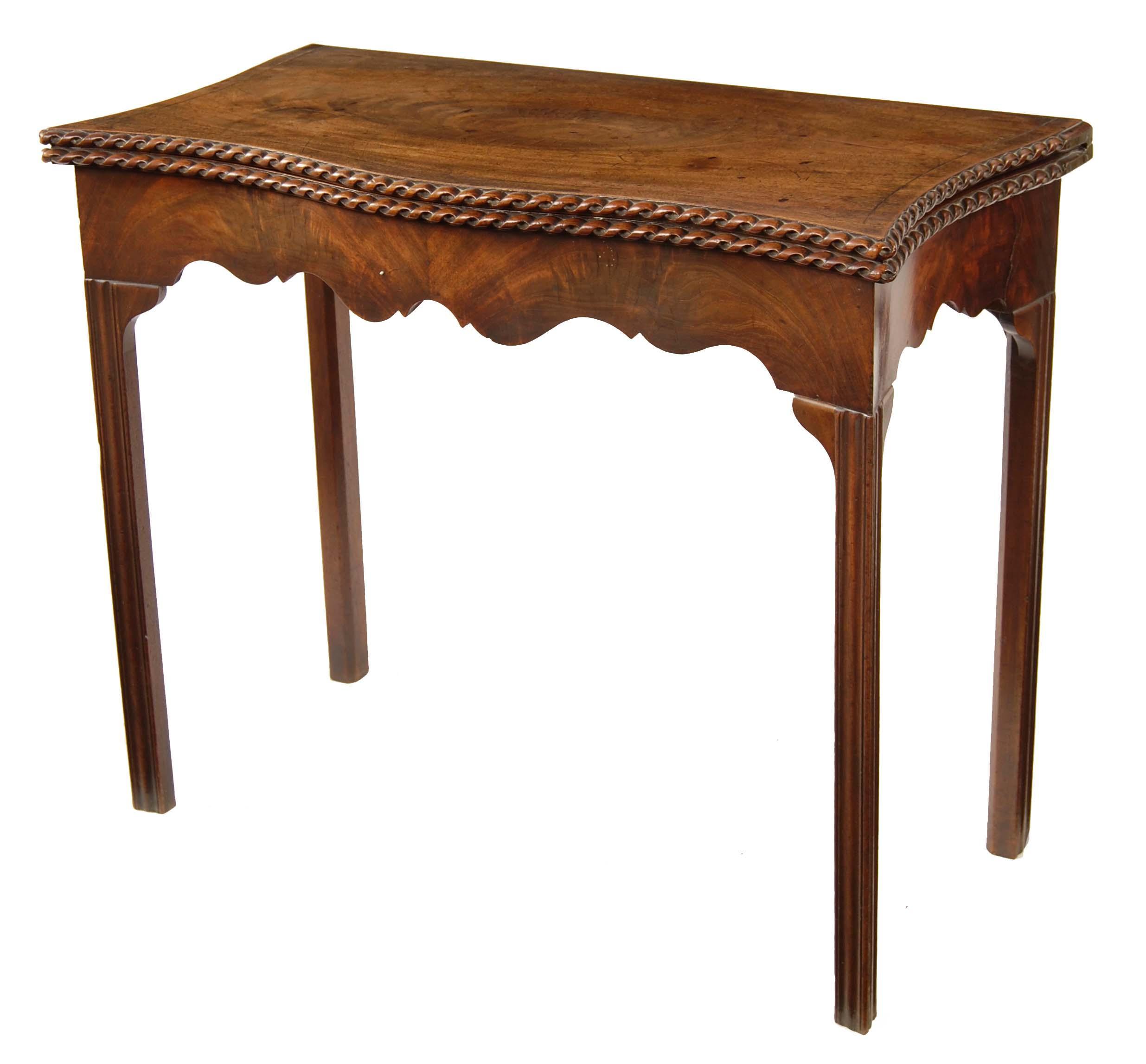 Appraisal: A George III mahogany serpentine tea table