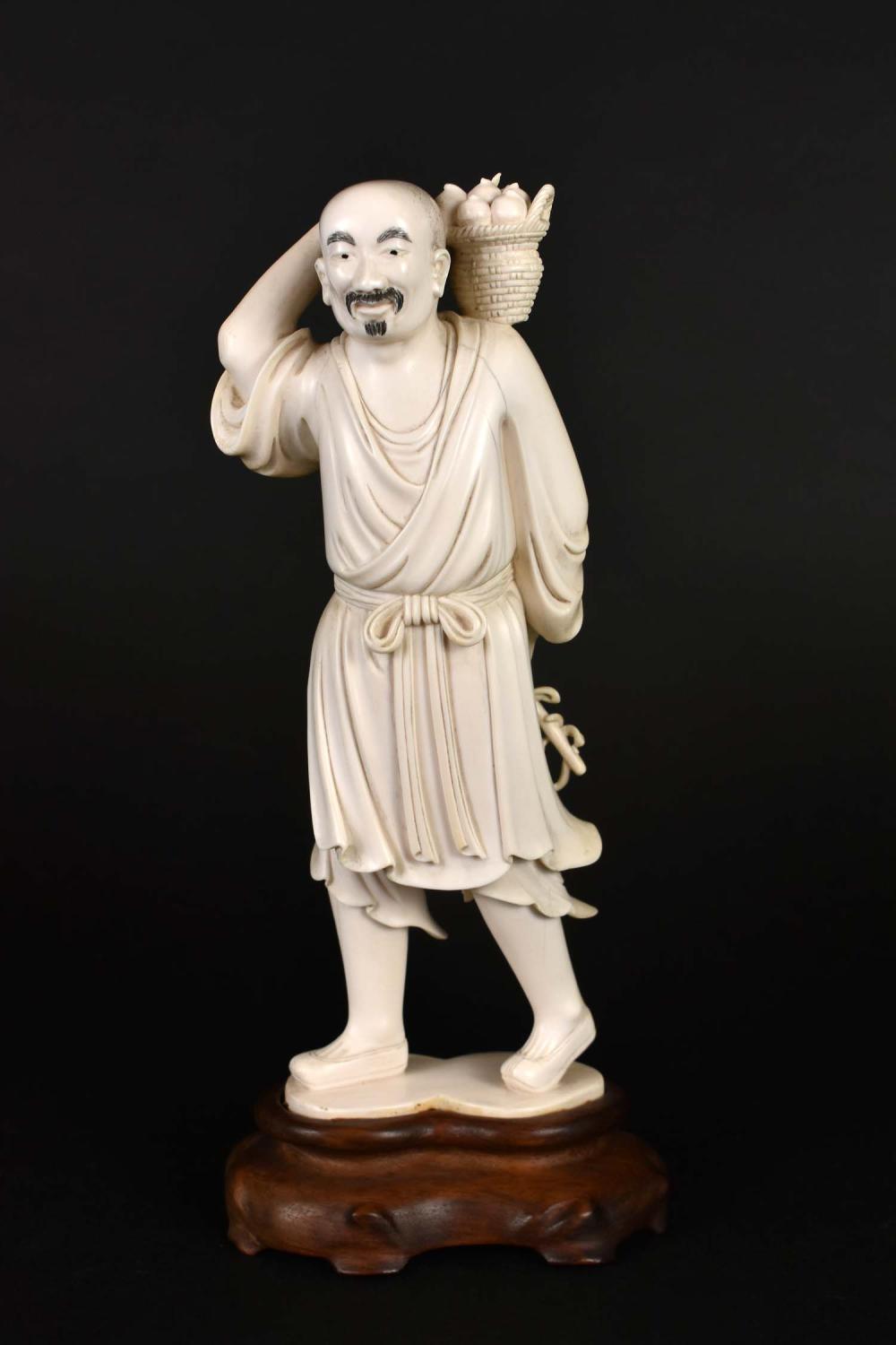 Appraisal: CHINESE MANCHU CARRYING A BASKET OF FRUITRepublic Period The underside