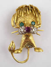 Appraisal: A French hallmarked carat gold lion brooch set with ruby