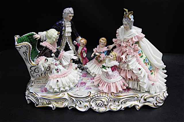 Appraisal: DRESDEN GERMAN PORCELAIN FIGURAL GROUP depicting a mother and father