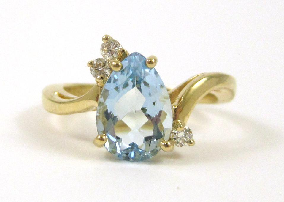 Appraisal: AQUAMARINE DIAMOND AND FOURTEEN KARAT GOLD RING set with three