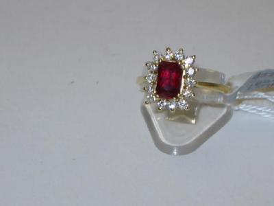 Appraisal: A RUBY AND DIAMOND CLUSTER RING comprising an emerald cut